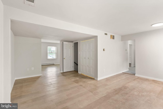 513 Tavenner Ct, Sterling, VA 20164 - unfurnished room with a baseboard heating unit, light wood-style flooring, and baseboards