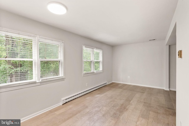 513 Tavenner Ct, Sterling, VA 20164 - unfurnished room featuring a baseboard heating unit, wood finished floors, and baseboards
