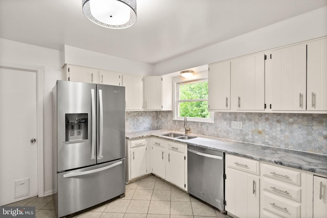 513 Tavenner Ct, Sterling, VA 20164 - kitchen with appliances with stainless steel finishes, a sink, light tile patterned floors, tasteful backsplash, and light stone countertops