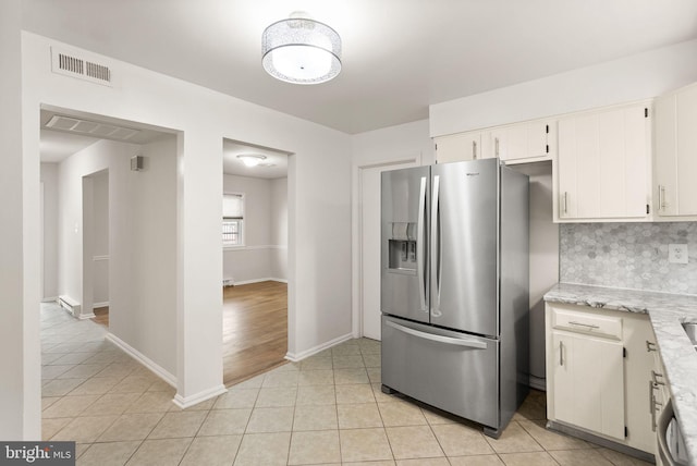 513 Tavenner Ct, Sterling, VA 20164 - kitchen with stainless steel refrigerator with ice dispenser, light tile patterned flooring, tasteful backsplash, white cabinetry, and baseboards