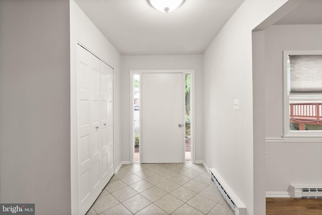 513 Tavenner Ct, Sterling, VA 20164 - foyer featuring a baseboard radiator, a baseboard heating unit, baseboards, and light tile patterned flooring