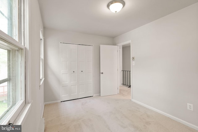 513 Tavenner Ct, Sterling, VA 20164 - unfurnished bedroom featuring carpet, multiple windows, baseboards, and a closet