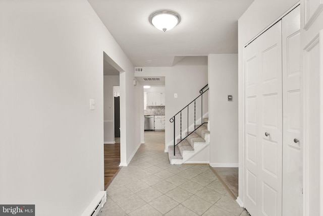 513 Tavenner Ct, Sterling, VA 20164 - entryway featuring stairs, light tile patterned floors, and baseboards