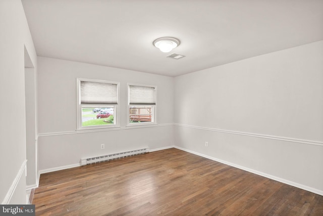 513 Tavenner Ct, Sterling, VA 20164 - unfurnished room featuring a baseboard heating unit, wood finished floors, and baseboards