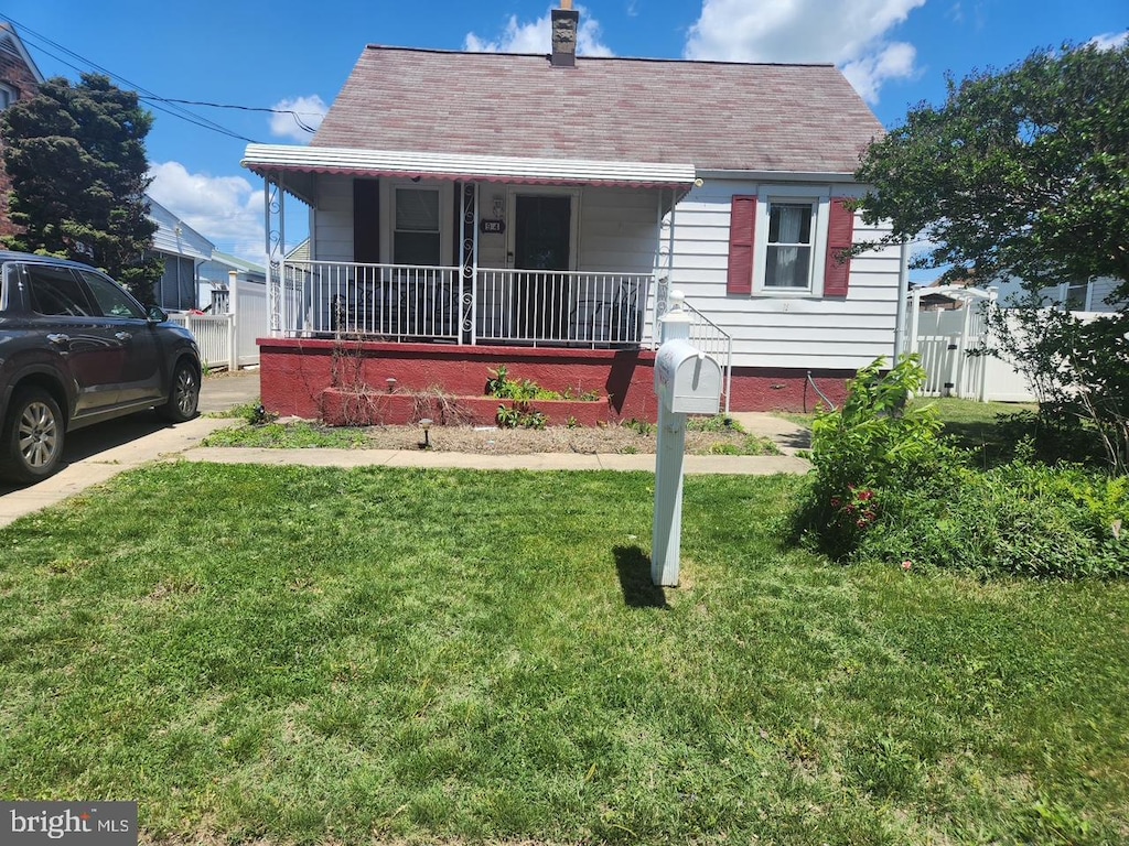 94 Avalon Ave, Baltimore, MD 21222 - view of front of property featuring a porch, a chimney, and roof with shingles