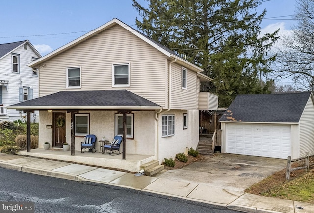 332 N Cedar St, Lititz, PA 17543 - view of front of property with a porch, an outbuilding, stucco siding, a shingled roof, and a detached garage