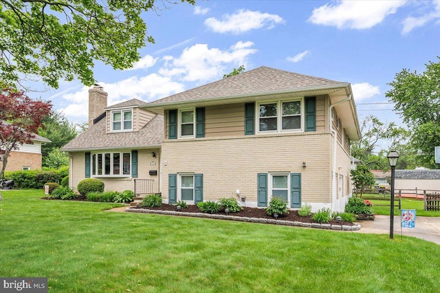 1206 Evergreen Rd, Wilmington, DE 19803 - tri-level home with a chimney, brick siding, and a shingled roof