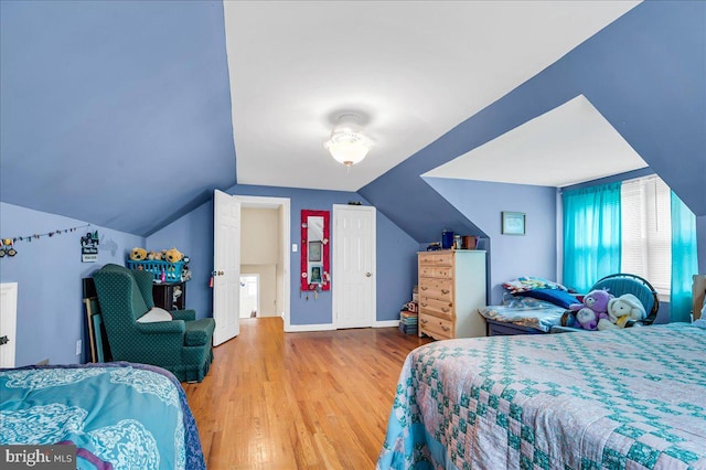 1206 Evergreen Rd, Wilmington, DE 19803 - bedroom with wood finished floors, vaulted ceiling, and baseboards
