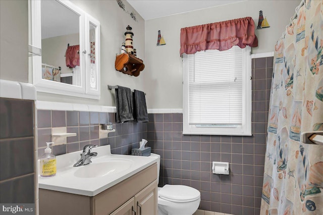1206 Evergreen Rd, Wilmington, DE 19803 - bathroom with toilet, tile walls, vanity, wainscoting, and a shower with shower curtain