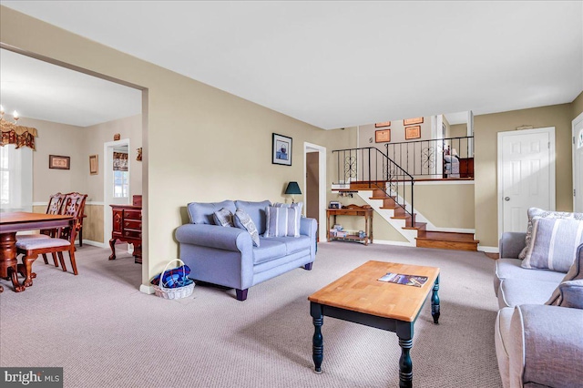 1206 Evergreen Rd, Wilmington, DE 19803 - living room featuring carpet floors, stairway, a chandelier, and baseboards