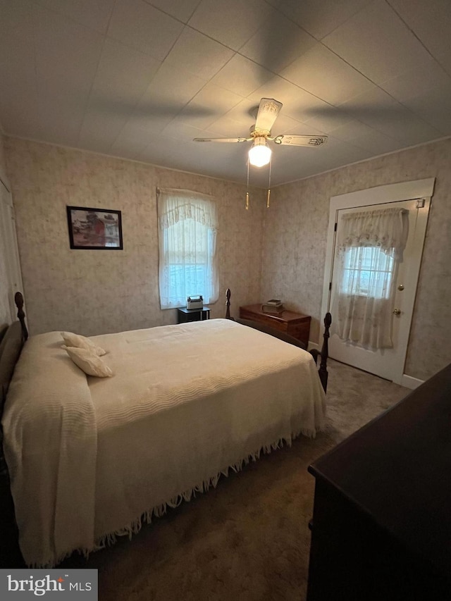 carpeted bedroom featuring ceiling fan