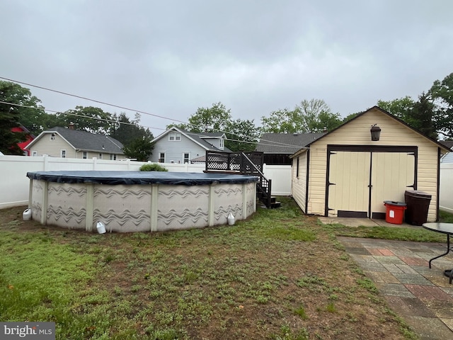 back of property with a storage unit and an outbuilding