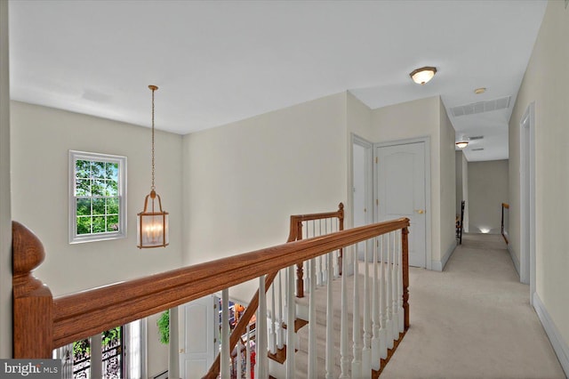 1507 N Adams St, Pottstown, PA 19464 - hall featuring light carpet, an upstairs landing, and baseboards