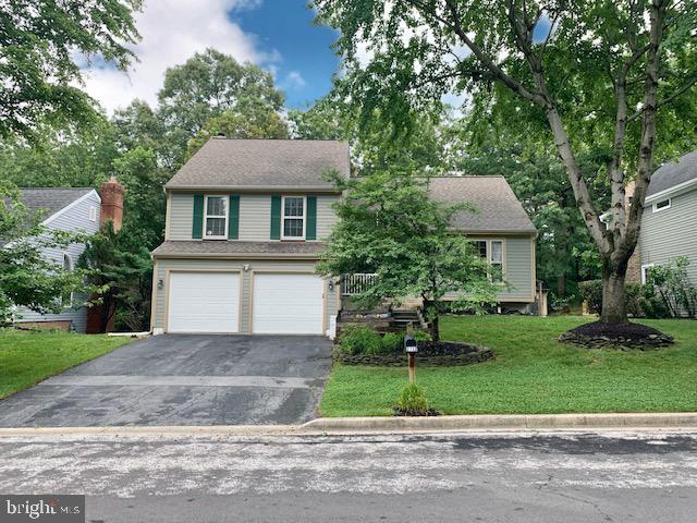2723 Deer Ridge Dr, Silver Spring, MD 20904 - view of front of house featuring driveway, a garage, and a front yard