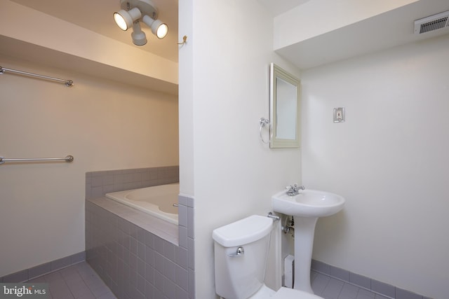 2723 Deer Ridge Dr, Silver Spring, MD 20904 - full bath featuring tile patterned floors, baseboards, a garden tub, and toilet