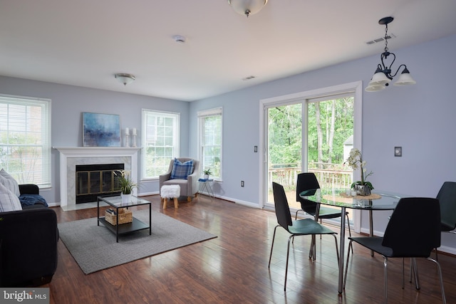2723 Deer Ridge Dr, Silver Spring, MD 20904 - living room featuring a chandelier, healthy amount of natural light, a high end fireplace, and wood finished floors