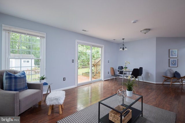 2723 Deer Ridge Dr, Silver Spring, MD 20904 - living room with wood finished floors, a chandelier, plenty of natural light, and baseboards