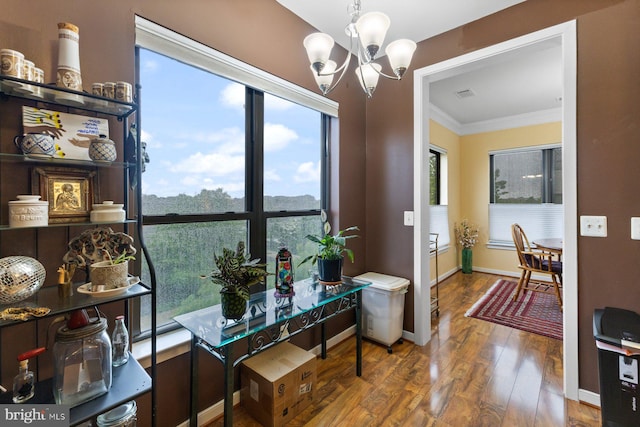8435 Peace Lily Ct Unit 314, Lorton, VA 22079 - dining space featuring hardwood / wood-style floors, a chandelier, ornamental molding, and baseboards