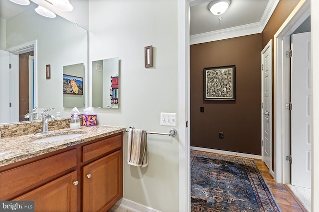 8435 Peace Lily Ct Unit 314, Lorton, VA 22079 - bathroom featuring ornamental molding, wood finished floors, vanity, and baseboards