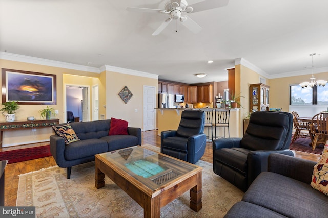 8435 Peace Lily Ct Unit 314, Lorton, VA 22079 - living room featuring a chandelier, light wood-style flooring, ornamental molding, and a ceiling fan