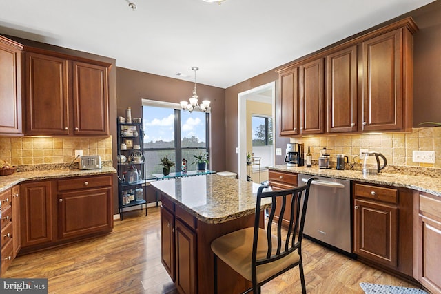 8435 Peace Lily Ct Unit 314, Lorton, VA 22079 - kitchen featuring stainless steel dishwasher, light wood-style flooring, a chandelier, and decorative backsplash