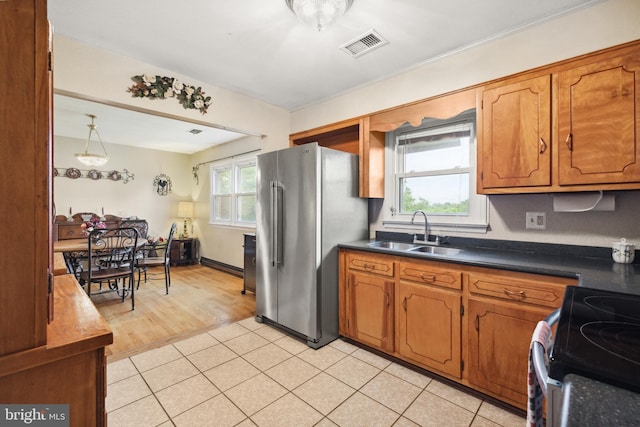 350 Poorhouse Rd, Winchester, VA 22603 - kitchen featuring a sink, freestanding refrigerator, electric range, dark countertops, and brown cabinets