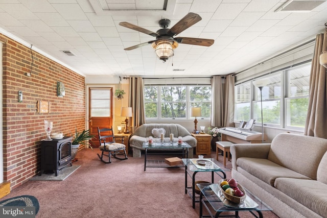350 Poorhouse Rd, Winchester, VA 22603 - carpeted living room featuring a wood stove, plenty of natural light, and ceiling fan