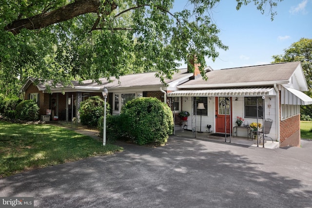 350 Poorhouse Rd, Winchester, VA 22603 - single story home featuring a chimney, a front yard, brick siding, and central AC unit