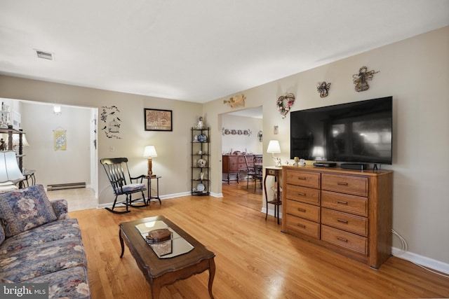350 Poorhouse Rd, Winchester, VA 22603 - living area with light wood-style flooring, a baseboard heating unit, and baseboards