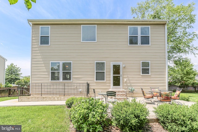 back of property featuring a patio area