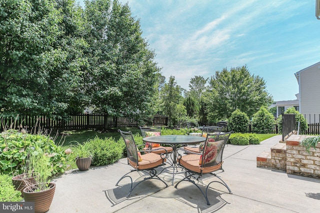 view of patio / terrace featuring outdoor dining area and fence