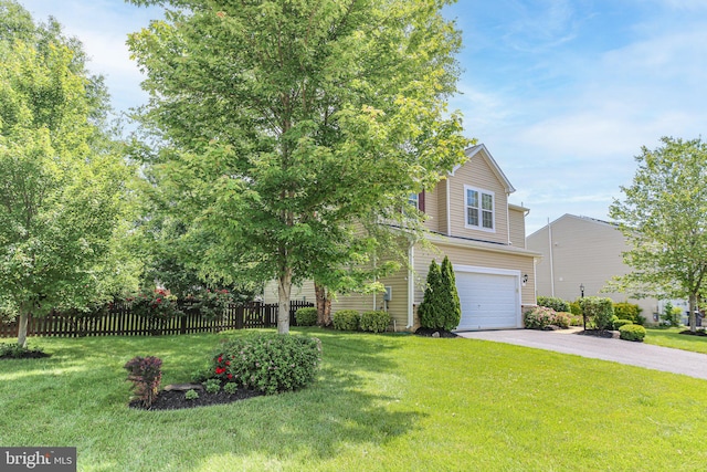 obstructed view of property featuring a garage and asphalt driveway