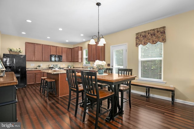 dining space featuring dark wood finished floors, recessed lighting, a chandelier, and baseboards