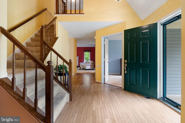 5212 Braywood Dr, Centreville, VA 20120 - entryway with hardwood / wood-style floors, stairway, baseboards, and vaulted ceiling