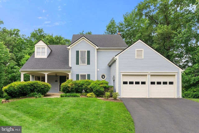 5212 Braywood Dr, Centreville, VA 20120 - traditional home with asphalt driveway, a garage, a front lawn, covered porch, and a shingled roof