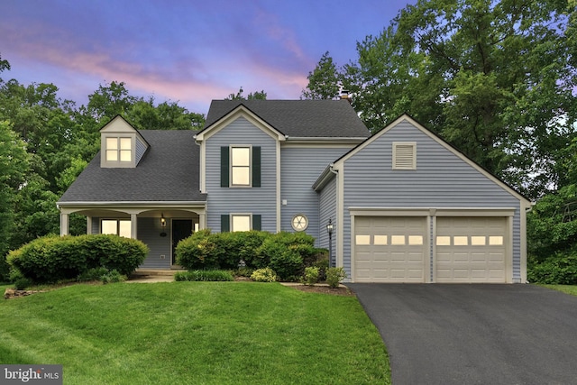 5212 Braywood Dr, Centreville, VA 20120 - traditional-style home featuring asphalt driveway, a garage, a yard, a shingled roof, and covered porch