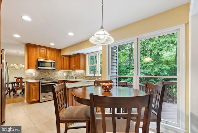 5212 Braywood Dr, Centreville, VA 20120 - dining space with recessed lighting, a chandelier, and light tile patterned flooring