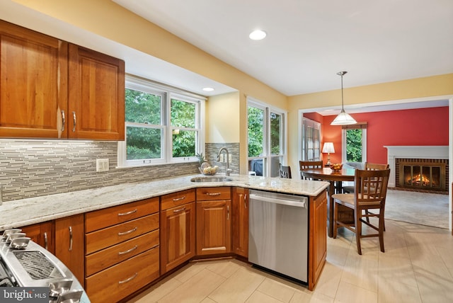 5212 Braywood Dr, Centreville, VA 20120 - kitchen featuring stainless steel dishwasher, brown cabinets, a sink, decorative backsplash, and light stone counters