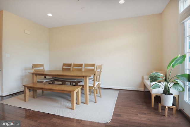 dining space with wood finished floors, baseboards, and recessed lighting