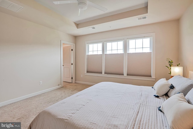 carpeted bedroom with baseboards and ceiling fan