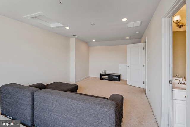 living room with light colored carpet, recessed lighting, and baseboards