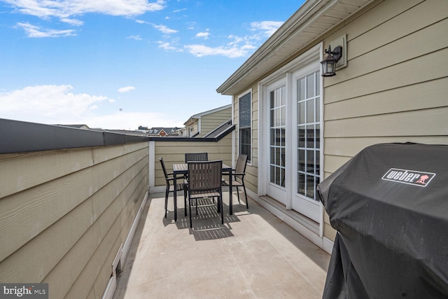 view of patio / terrace featuring area for grilling and outdoor dining space