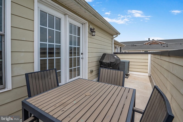 wooden deck featuring outdoor dining area