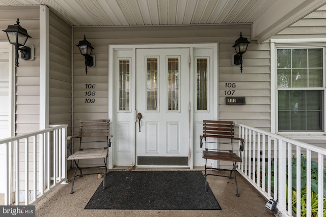 doorway to property featuring a porch