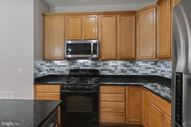 23466 Twin Falls Ter, Brambleton, VA 20148 - kitchen featuring appliances with stainless steel finishes, dark stone counters, backsplash, and brown cabinetry