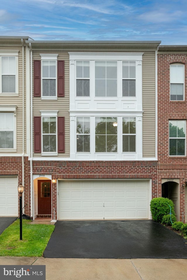 23466 Twin Falls Ter, Brambleton, VA 20148 - multi unit property with driveway and a garage