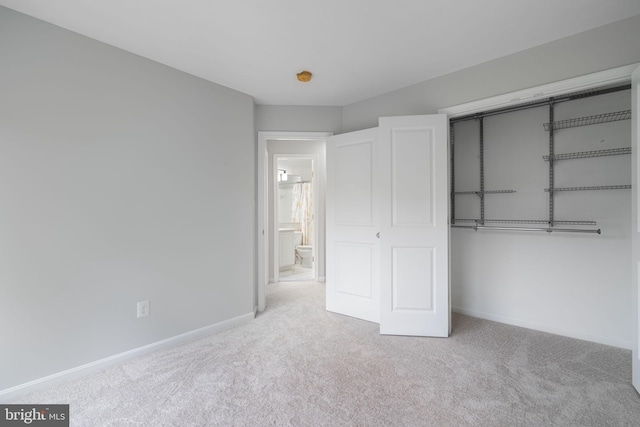 23466 Twin Falls Ter, Brambleton, VA 20148 - unfurnished bedroom featuring carpet flooring, baseboards, and a closet
