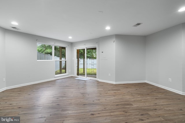 23466 Twin Falls Ter, Brambleton, VA 20148 - spare room featuring recessed lighting, healthy amount of natural light, wood finished floors, and baseboards