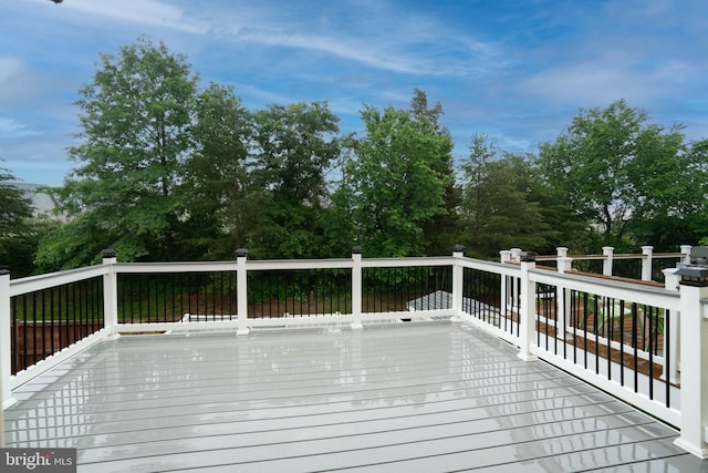 23466 Twin Falls Ter, Brambleton, VA 20148 - wooden terrace with view of wooded area