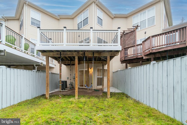 23466 Twin Falls Ter, Brambleton, VA 20148 - rear view of property with a wooden deck and central AC